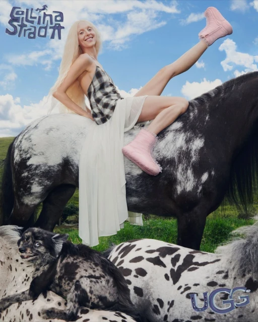 A woman in pink boots poses on a horse in a fashion editorial shot against a sky background, with other animals and brand logos.