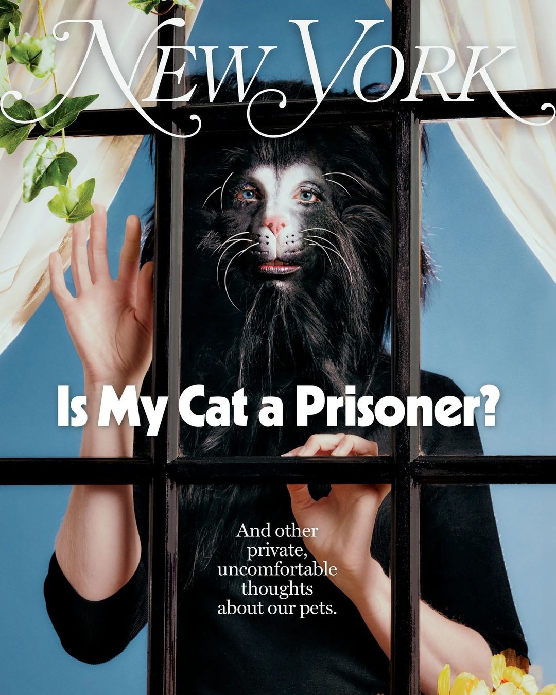 Magazine cover featuring person with cat face paint looking out window with floral vines, with text “New York” and “Is My Cat a Prisoner?”