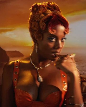 Portrait of a Black woman with intricate red-toned updo hair wearing an orange top and diamond jewelry against a sunset sky.