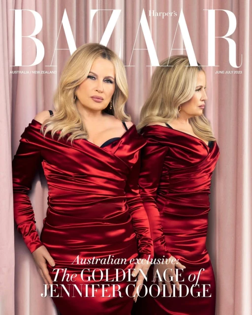 Jennifer Coolidge stars on Harper's Bazaar Australia cover. The actress wears a red satin off-the-shoulder dress against a pink backdrop.