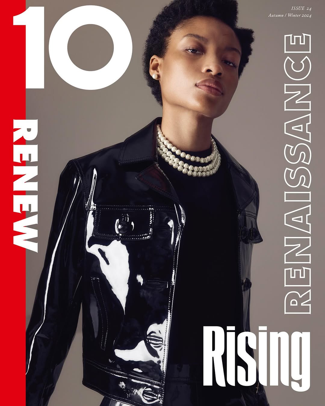 Magazine cover featuring a Black model in a black patent leather jacket, pearl necklaces, and a bold white and red text layout.