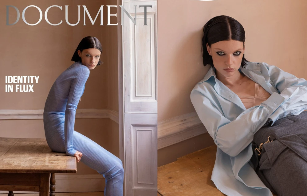 Fashion editorial featuring a model in two poses, one in a blue knit outfit seated on a table, the other in a shirt and pants leaning against a wall.