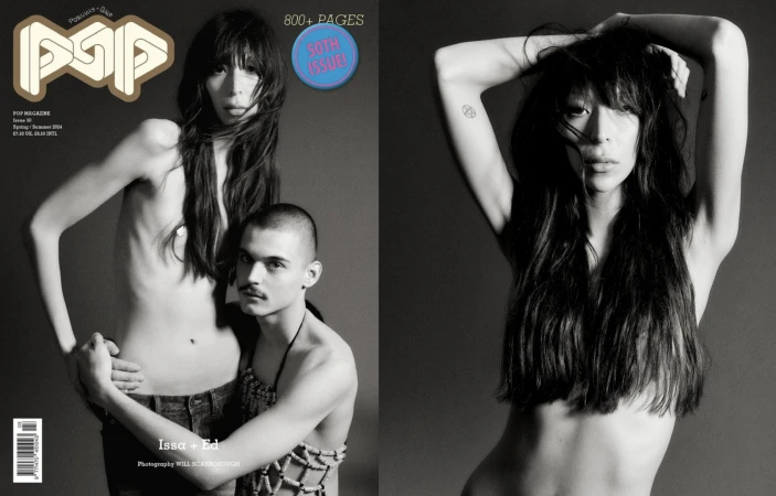 Black and white editorial magazine spread featuring two models against a grey studio backdrop with typography overlay.