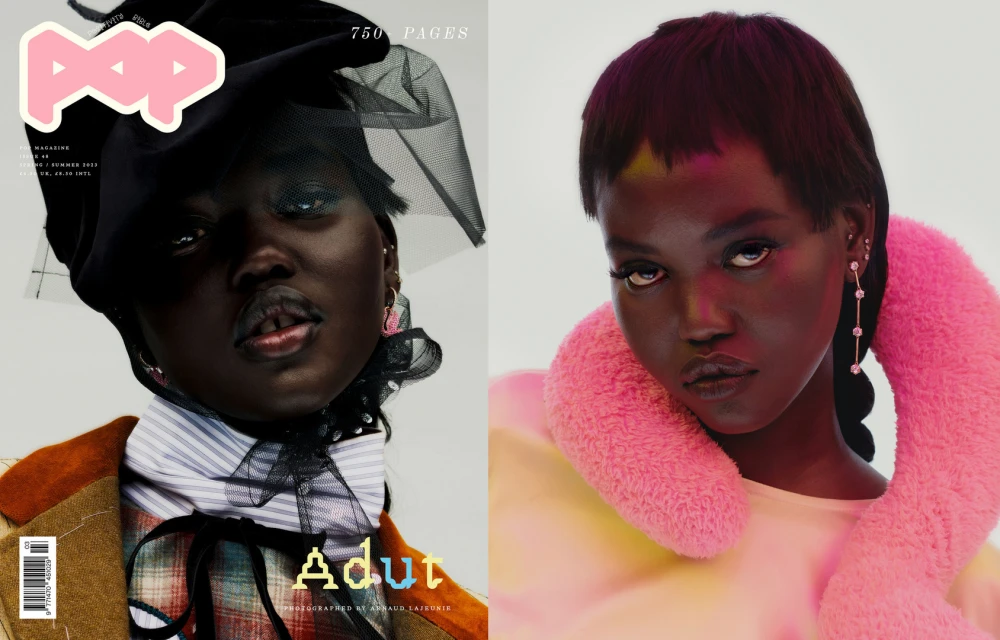 Magazine cover featuring two close-up portraits of a dark-skinned model wearing a hat with netting and a pink furry collar.