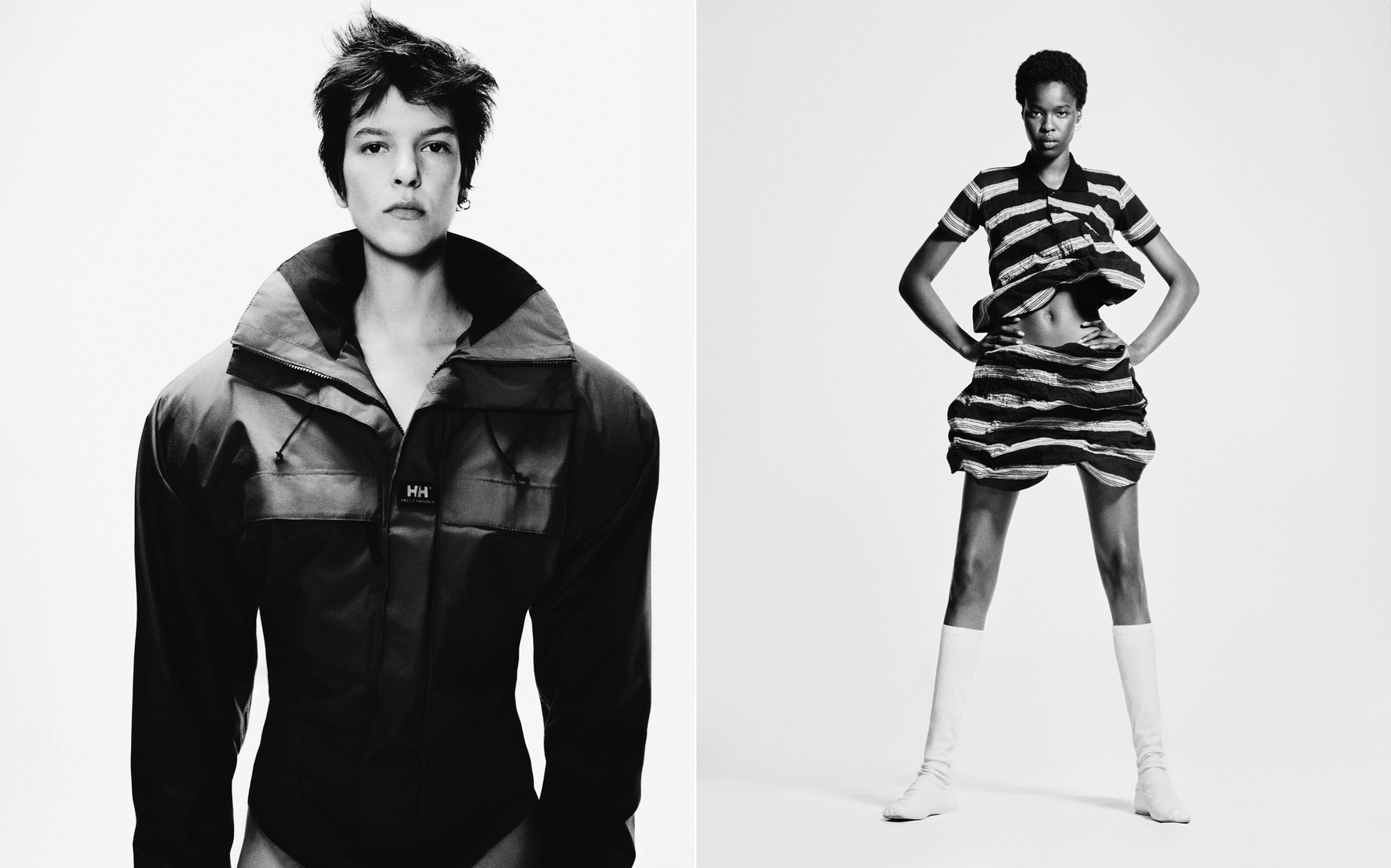Two fashion models posing in a black and white photo. One model wears a dark jacket and the other wears a striped skirt set.