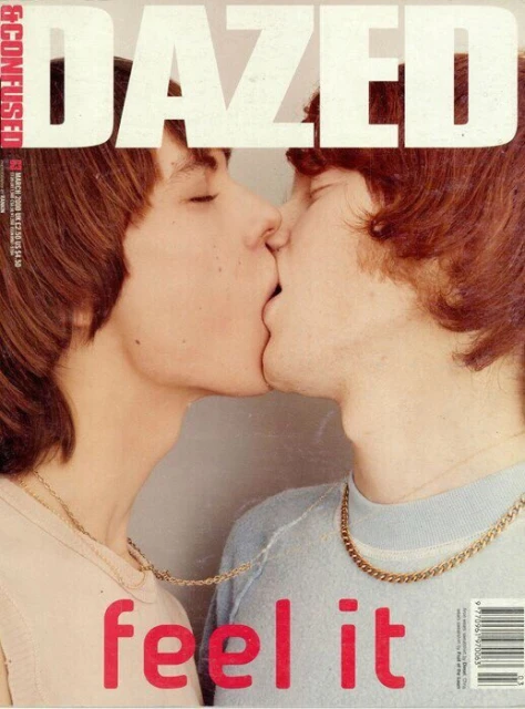 Dazed & Confused cover featuring two adult males kissing, facing each other with light-colored shirts, wearing gold necklaces.