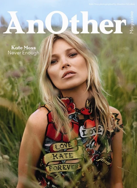 Magazine cover of Kate Moss in floral top amidst grassy background, shot at eye level. 'Another' magazine displayed in bold.