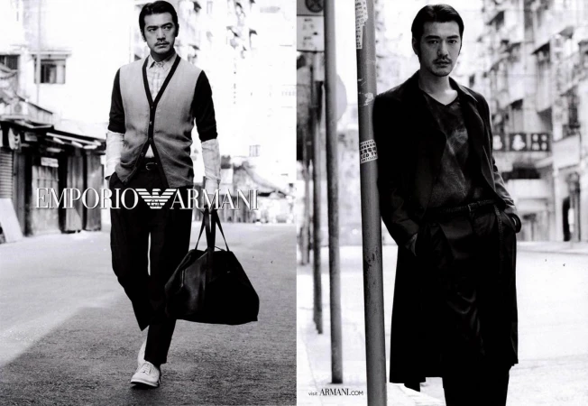 Two black and white images featuring a stylish Asian man in fashionable attire, one walking and another leaning against a post outdoors.