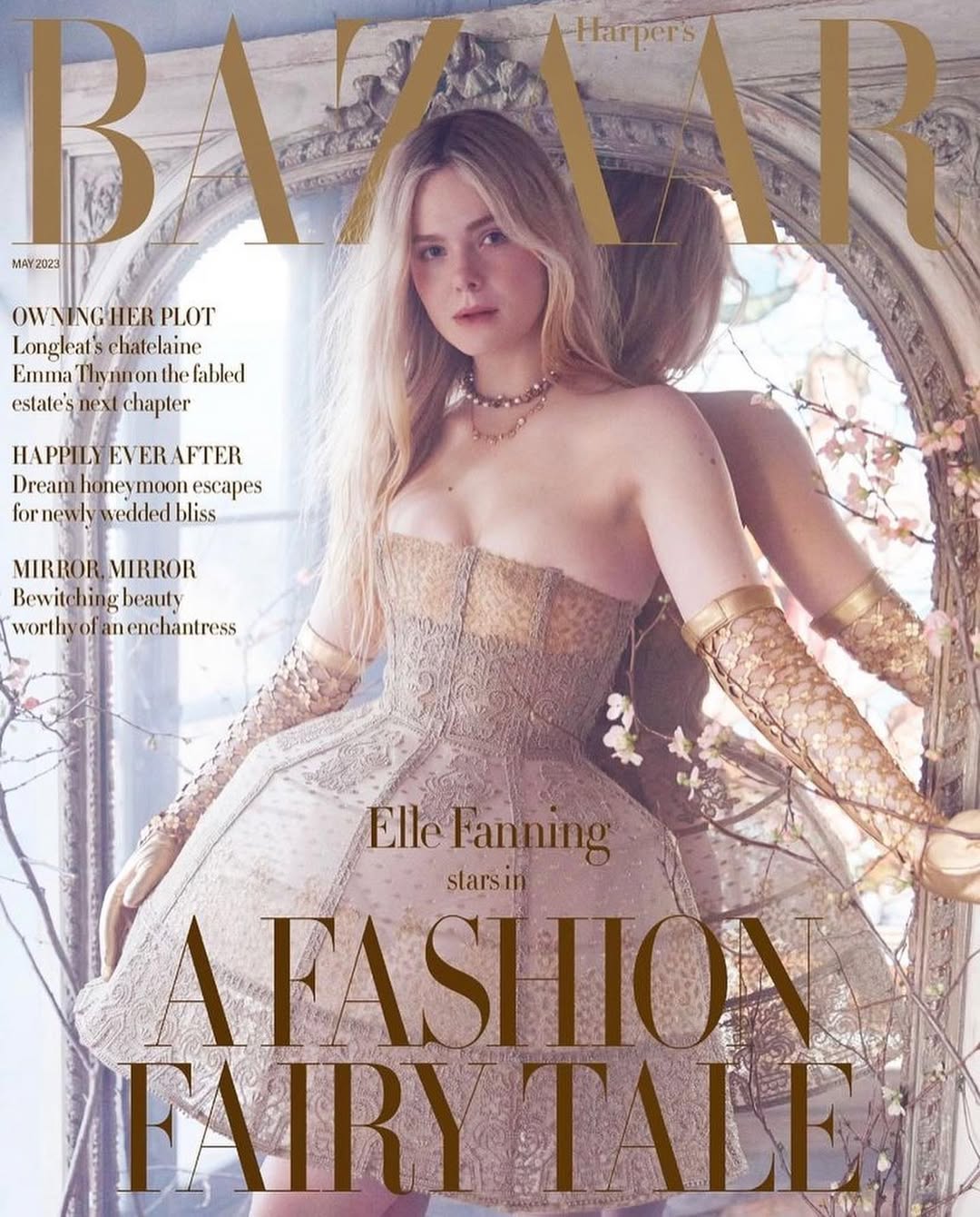 Elle Fanning graces the cover of Bazaar magazine in a strapless lace dress with gold gloves and a dreamy, fairytale-inspired backdrop.