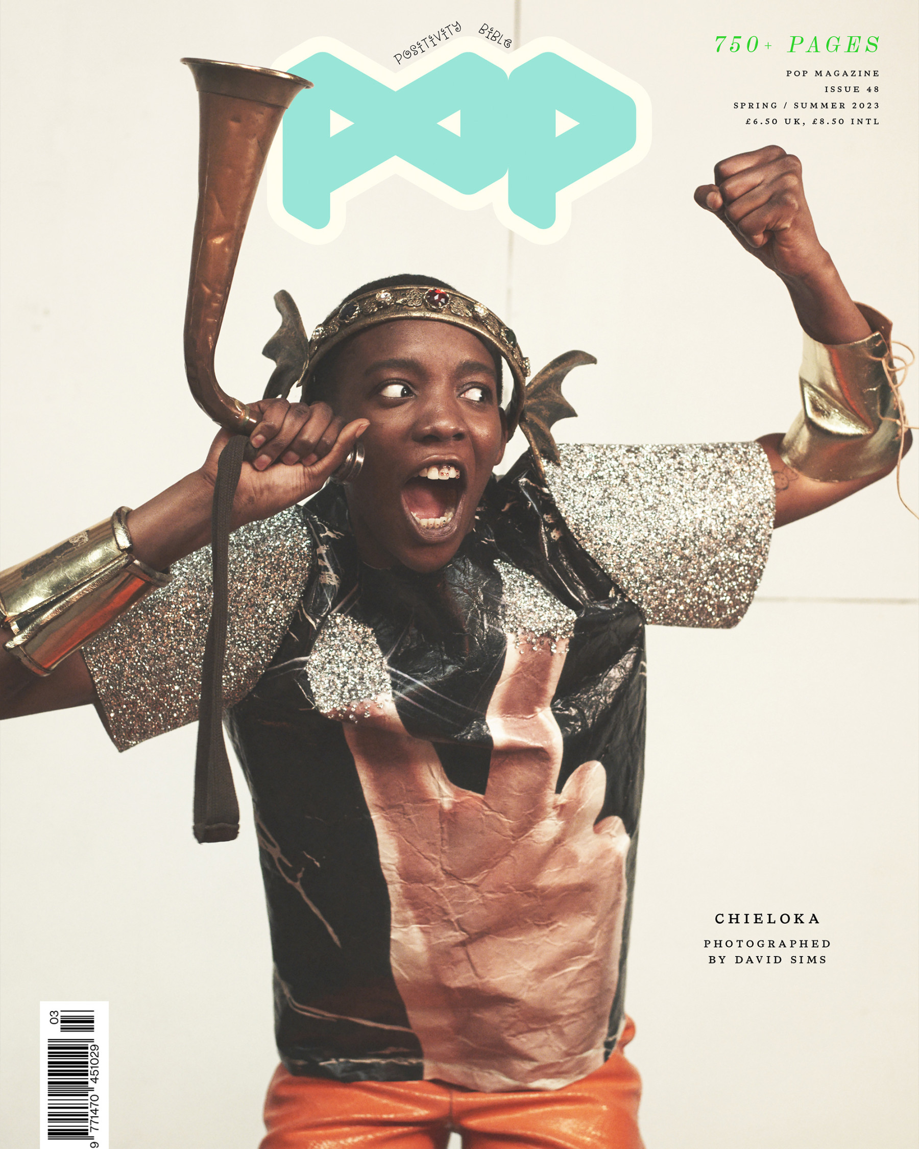Magazine cover featuring a child model in an eye-catching outfit holding a horn, with POP logo, against a clean white backdrop.