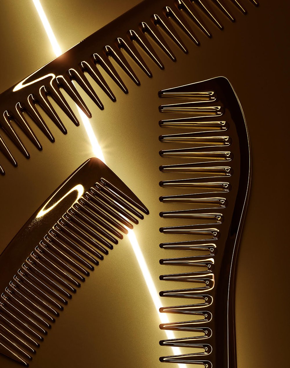A close-up of three brown combs, with tines facing different directions, illuminated by a bright, white light in a high-angle shot.