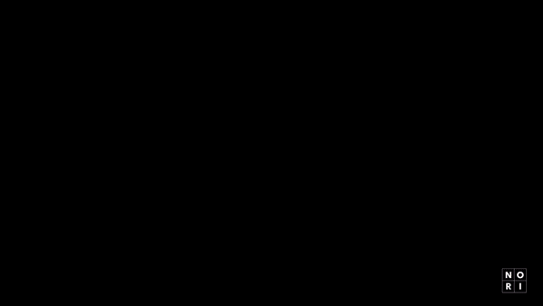 Abstract black and white studio shot of a brand logo in the corner of the frame, offering a minimalist and clean aesthetic.