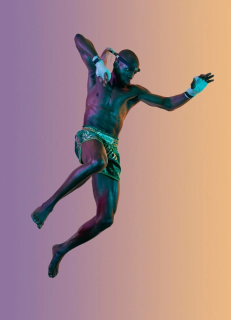 Muscular man in Thai boxing stance mid-air, wearing traditional shorts, hand wraps, and headgear, against a gradient background.