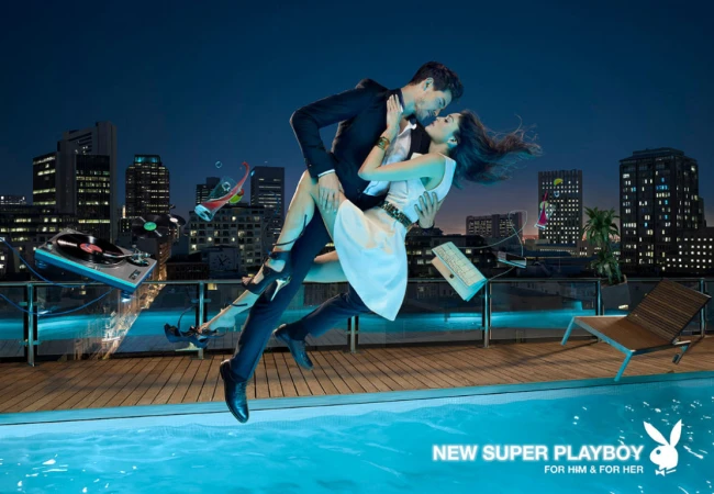 Couple in formal wear in mid-air embrace on rooftop terrace. Floating objects, city skyline, pool, nighttime, visual effects.