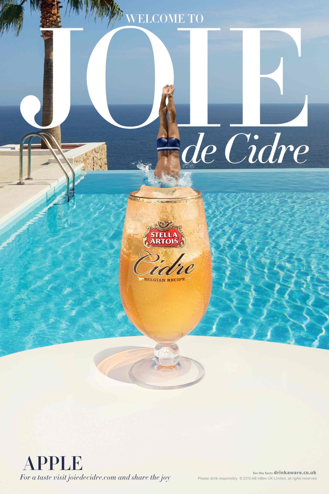 Stella Artois Cidre ad featuring a swimmer diving into a pool with a drink glass in the foreground, set against a sunny poolside scene.