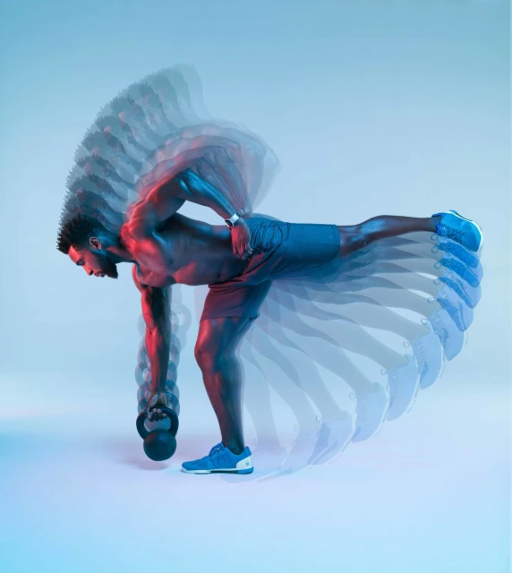 Athletic man performing single-leg deadlift exercise with kettlebell in a studio with light blue and red gradients, captured with motion blur.