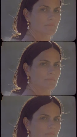 Film strip triptych portrait of a woman wearing drop pearl earrings captured by photographer Amie Milne.