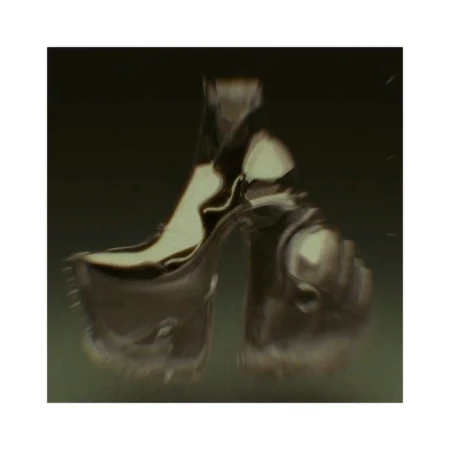 A high-heeled platform shoe is shown in a surreal style, likely fashion-related, with blurred focus against a dark, blurry backdrop.