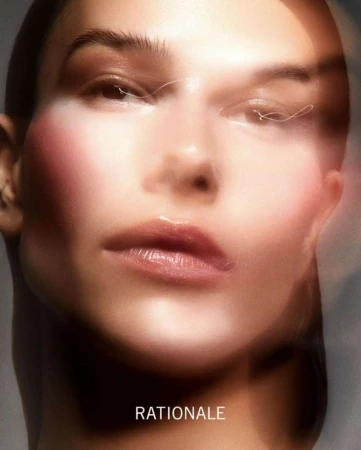 Close-up beauty portrait of a woman with blurred glowing skin effects and minimal makeup by Justin Ridler.