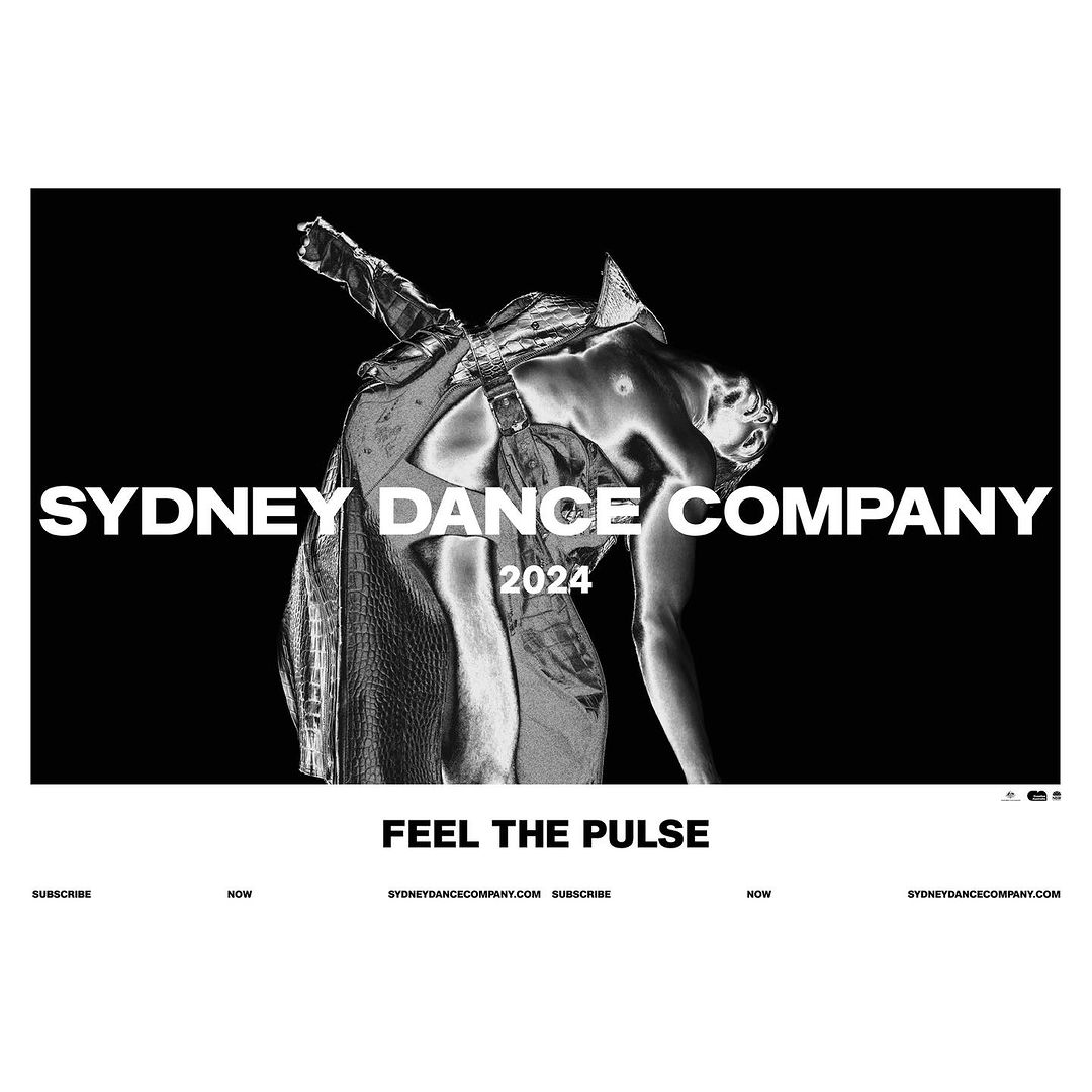 Striking monochrome image promoting Sydney Dance Company 2024, featuring a dancer in draped fabrics against a stark black background.