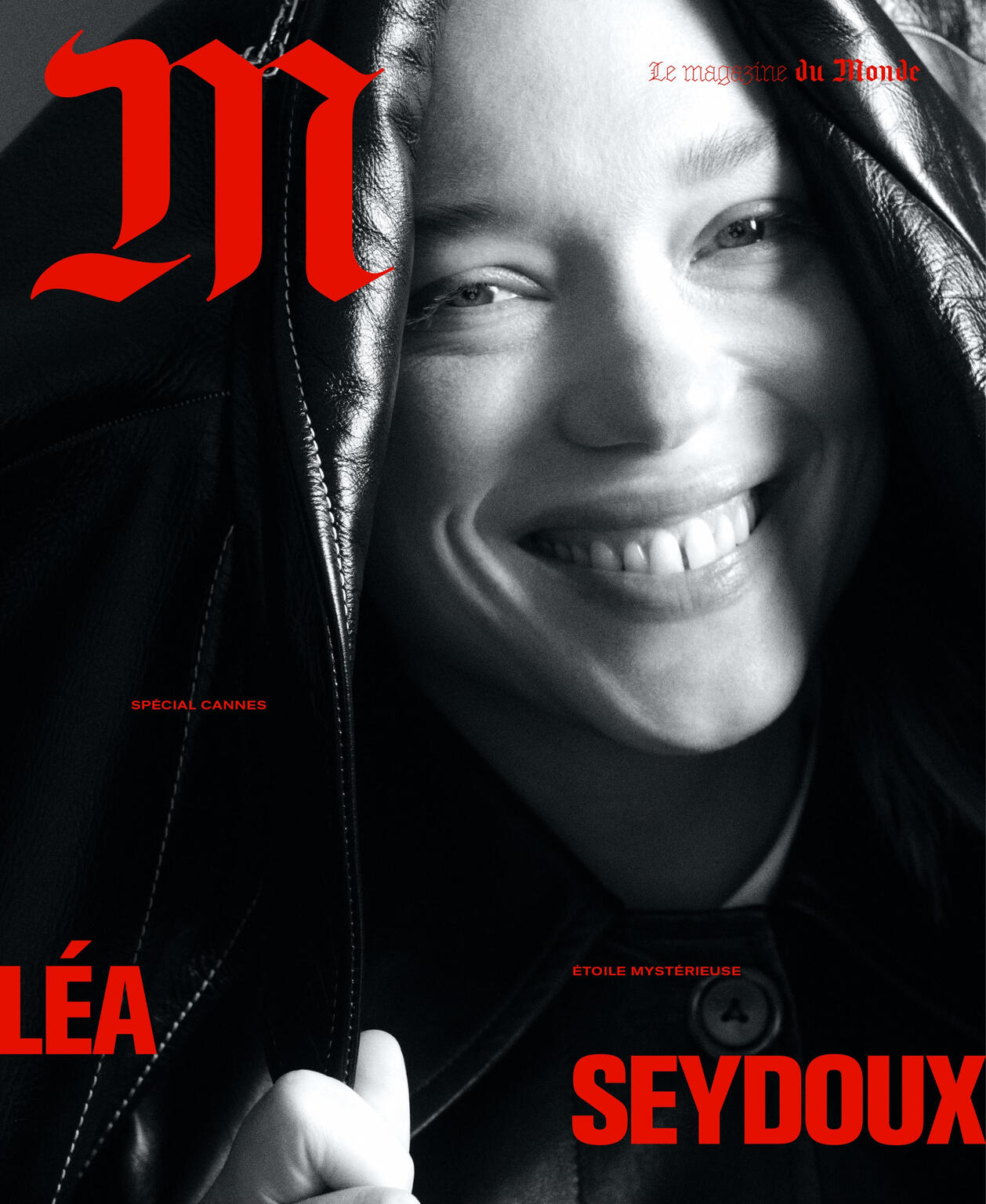 Fashion magazine cover featuring Léa Seydoux smiling, wearing a black leather jacket. The magazine's title, 'M', is in large red font.