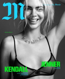 Kendall Jenner wearing a sheer black bra and silver necklace against a grey seamless backdrop for M le magazine du Monde.