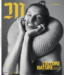 Gisele Bündchen wearing a chunky knit collar against a grey studio backdrop for a magazine cover in Paris
