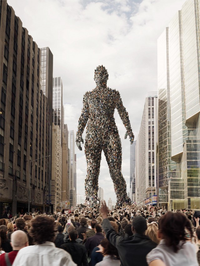 Large digital composite of a crowd forming a human-like giant standing on a city street, with a dense crowd of people below.