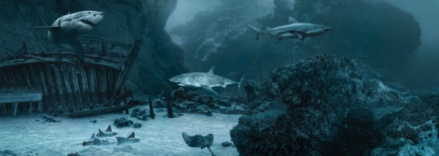 Underwater scene of multiple sharks swimming around a sunken ship and coral reef formations, creating a mysterious ocean atmosphere.