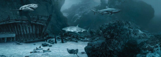 Underwater scene of multiple sharks swimming around a sunken ship and coral reef formations, creating a mysterious ocean atmosphere.