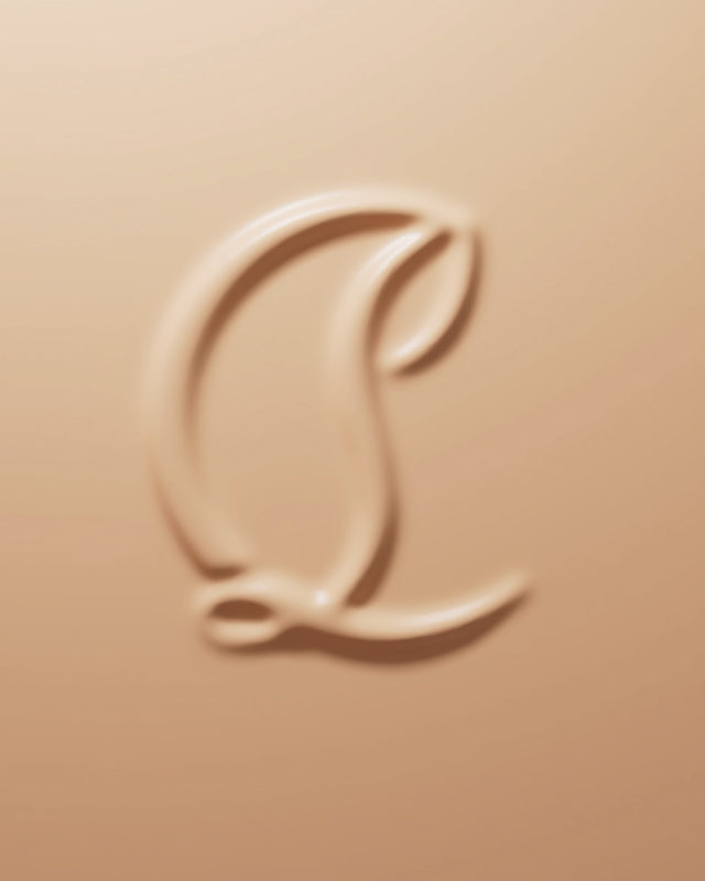 Close-up shot of beige makeup product with an embossed logo design. Cosmetic background with smooth and glossy texture.