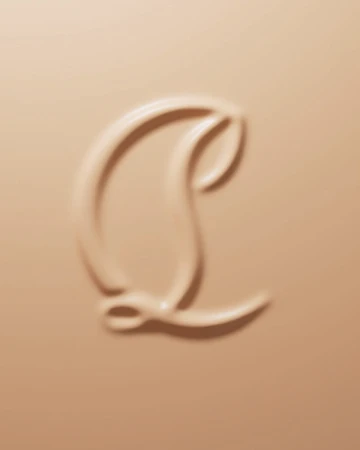 Close-up shot of beige makeup product with an embossed logo design. Cosmetic background with smooth and glossy texture.