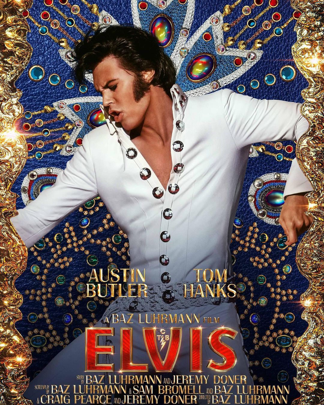 Movie poster for Elvis features Austin Butler in a white jumpsuit against a blue jeweled background with a gold ornate border.