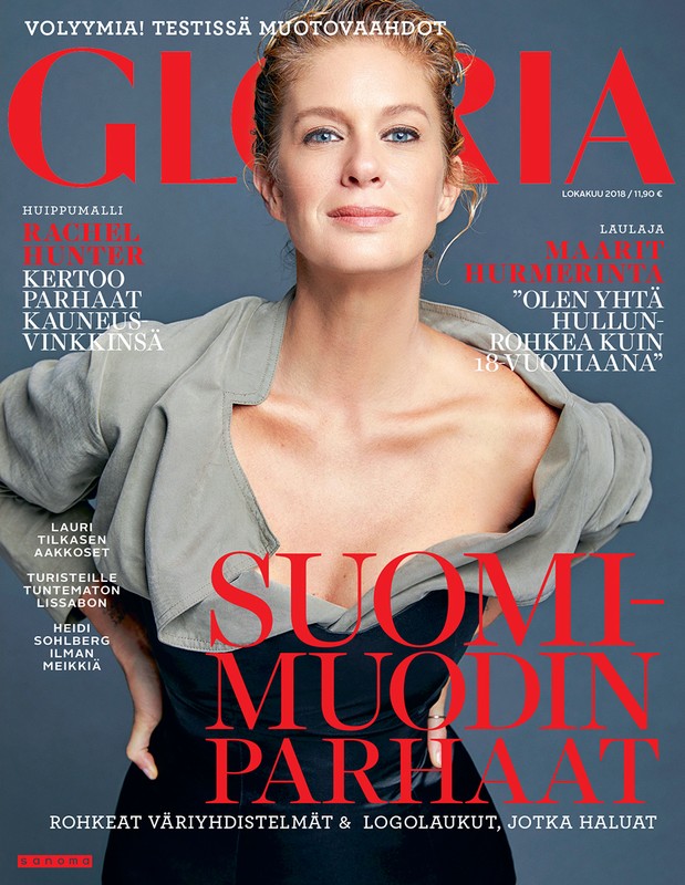 Magazine cover featuring a blonde woman wearing a grey blazer, against a grey background with red and black lettering, and Finnish text.