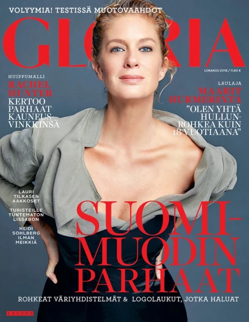 Magazine cover featuring a blonde woman wearing a grey blazer, against a grey background with red and black lettering, and Finnish text.