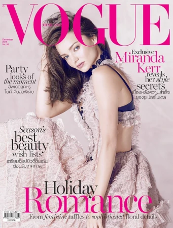 Magazine cover featuring Miranda Kerr wearing a lacy pink dress. The cover promotes stories on holiday romance, beauty wish lists, and style secrets.
