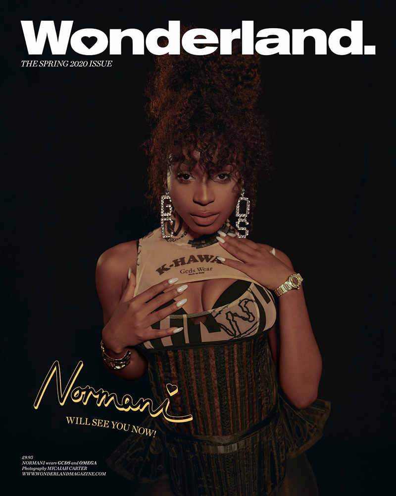 Wonderland magazine cover featuring Normani in a fashion shot. She is wearing a cropped top, corset, and statement earrings against a black background.