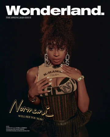 Wonderland magazine cover featuring Normani in a fashion shot. She is wearing a cropped top, corset, and statement earrings against a black background.