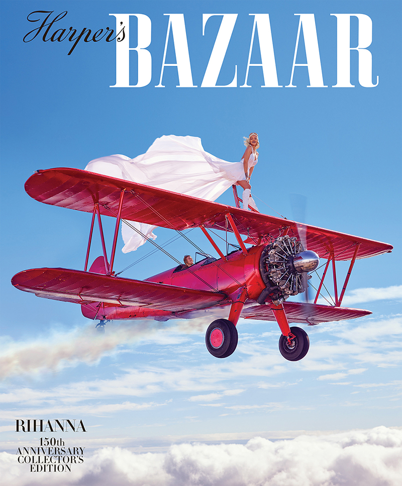 Harper's Bazaar cover featuring woman in white dress standing on red biplane against blue sky with clouds, "Rihanna 150th Anniversary".