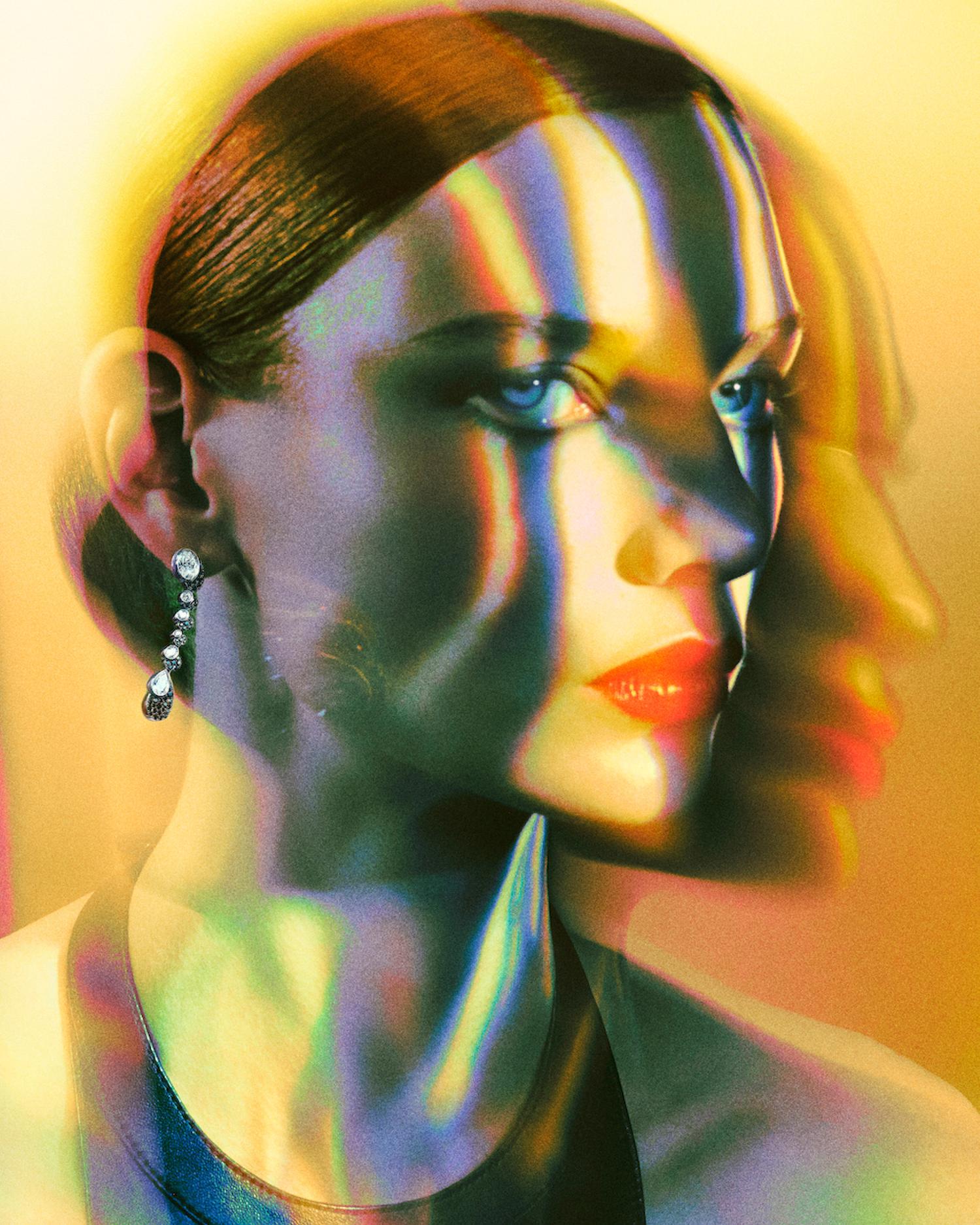 Striking portrait of a fair-skinned woman with red lipstick and blue eyes, featuring a double exposure and refracted light effects.