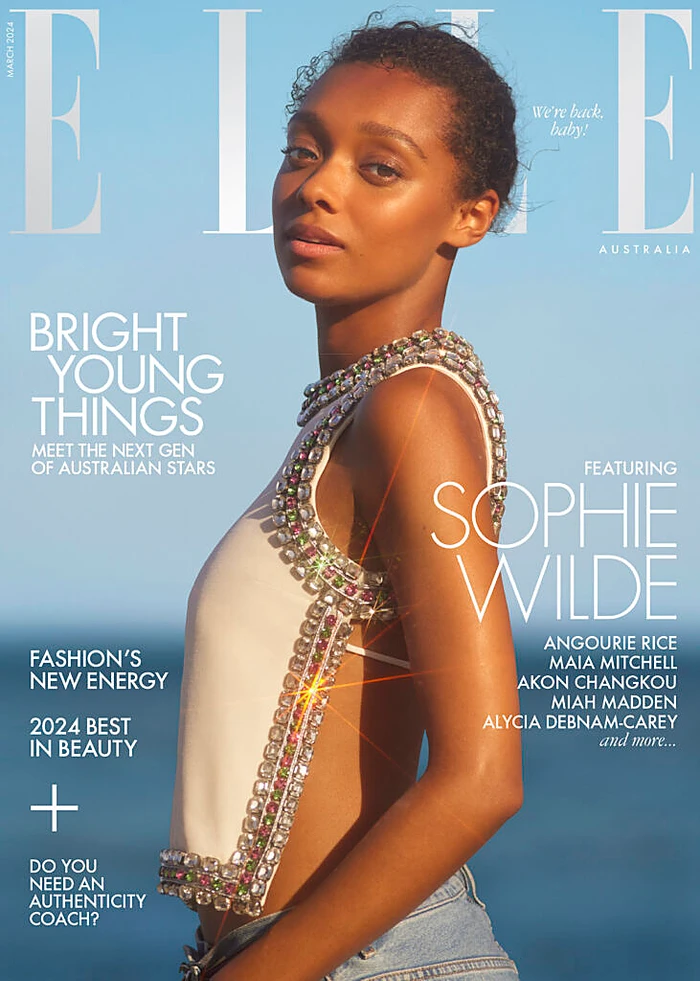 Magazine cover portrait of actress Sophie Wilde wearing an embellished white top against a clear blue sky