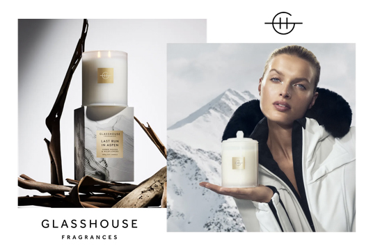 Glasshouse Fragrances product shot featuring a candle on a marble box next to a portrait of a model holding a candle.