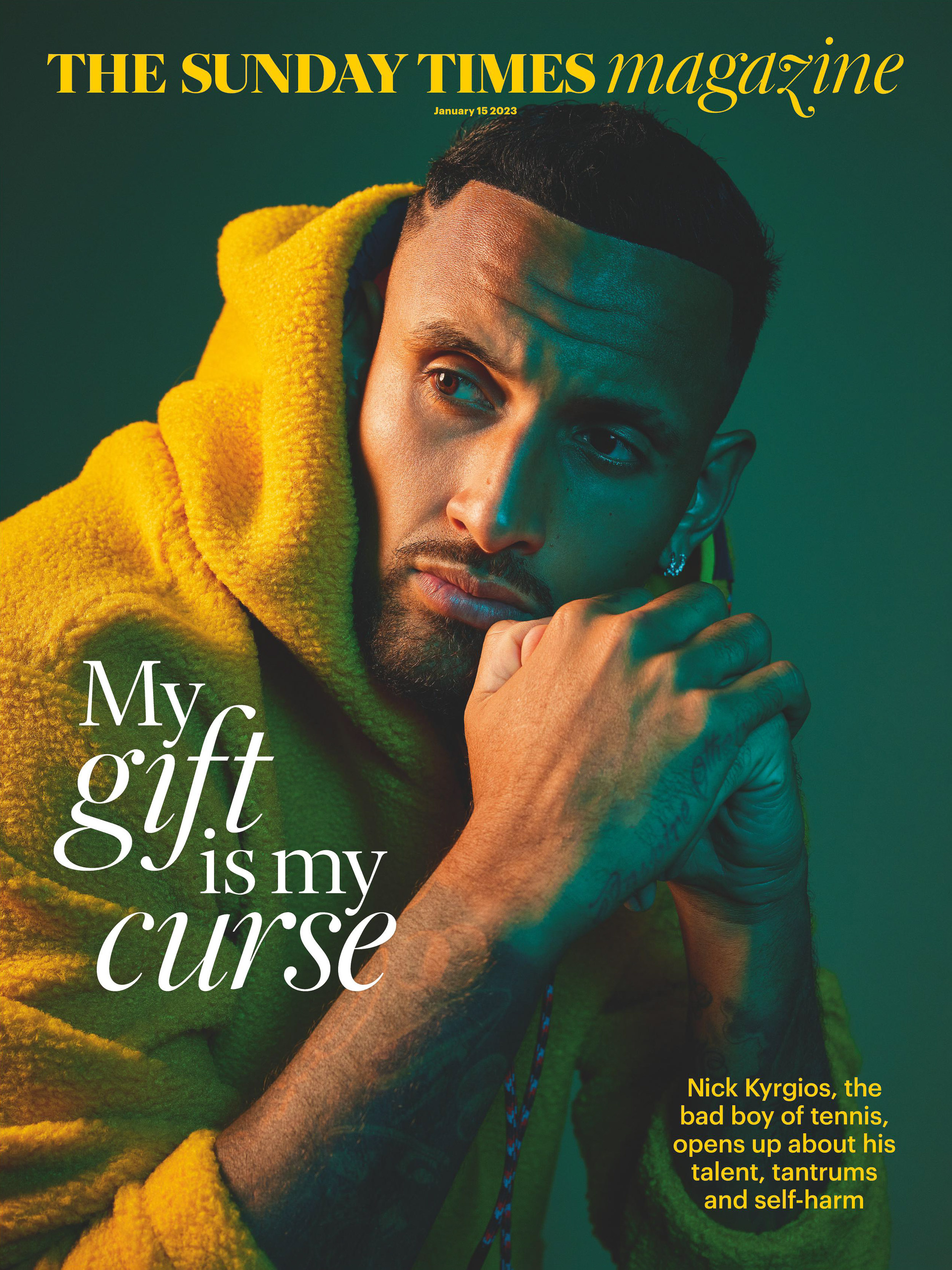 Magazine cover featuring Nick Kyrgios, the tennis star, in a yellow hoodie against a green backdrop, with a contemplative expression.