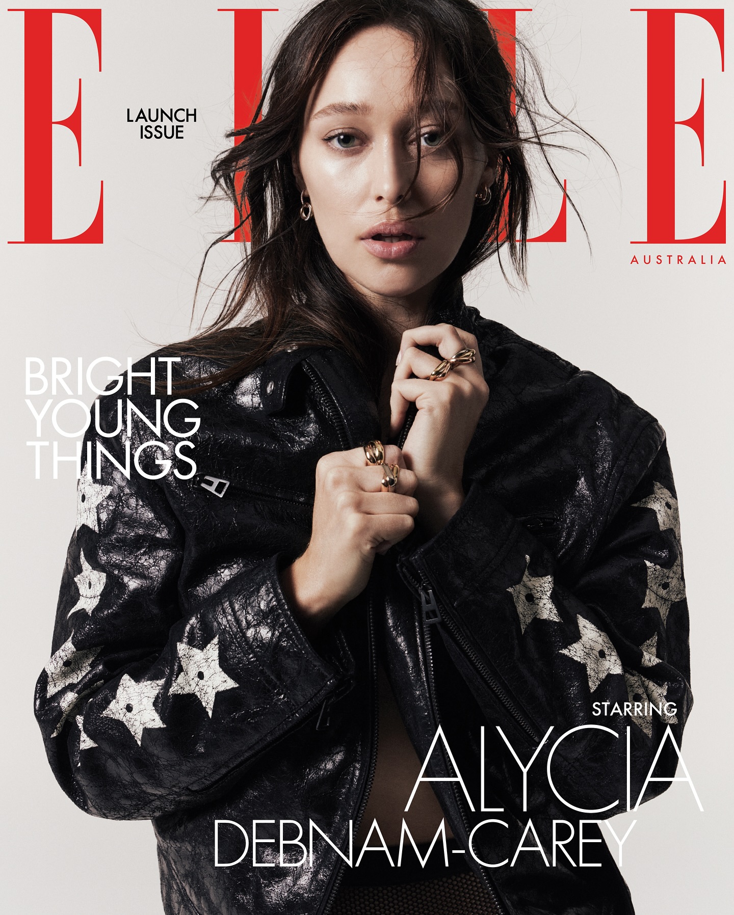 Alycia Debnam-Carey, Elle Australia launch issue cover, wearing a star-studded black leather jacket with red masthead logo.