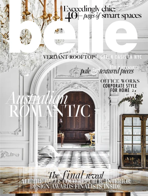Belle magazine cover featuring an interior design awards issue with a detailed architectural backdrop, chandelier, and muted color palette.