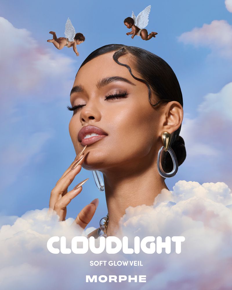 Beauty advertisement featuring a woman with glamorous makeup, sculpted fingernails, and cherubs against a dreamy sky background.