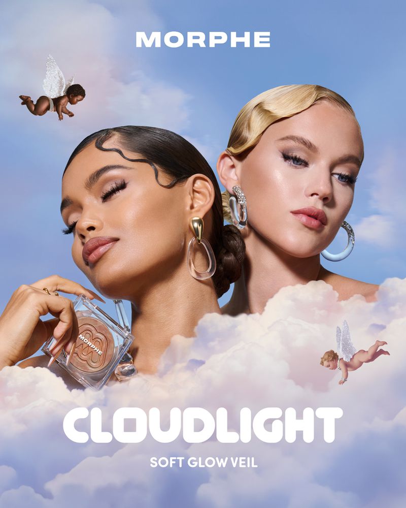 Two fashion models pose with Morphe makeup in a dreamy, angelic beauty shot with fair skin, light wavy hair, and cherubic winged figures.