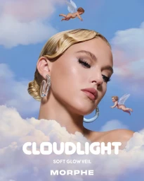 Model with blonde hair and glowing makeup posing against a blue sky with fluffy white clouds and flying cherubs.