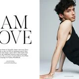 Troye Sivan wearing a black tank top in a minimalist studio setting for Russh