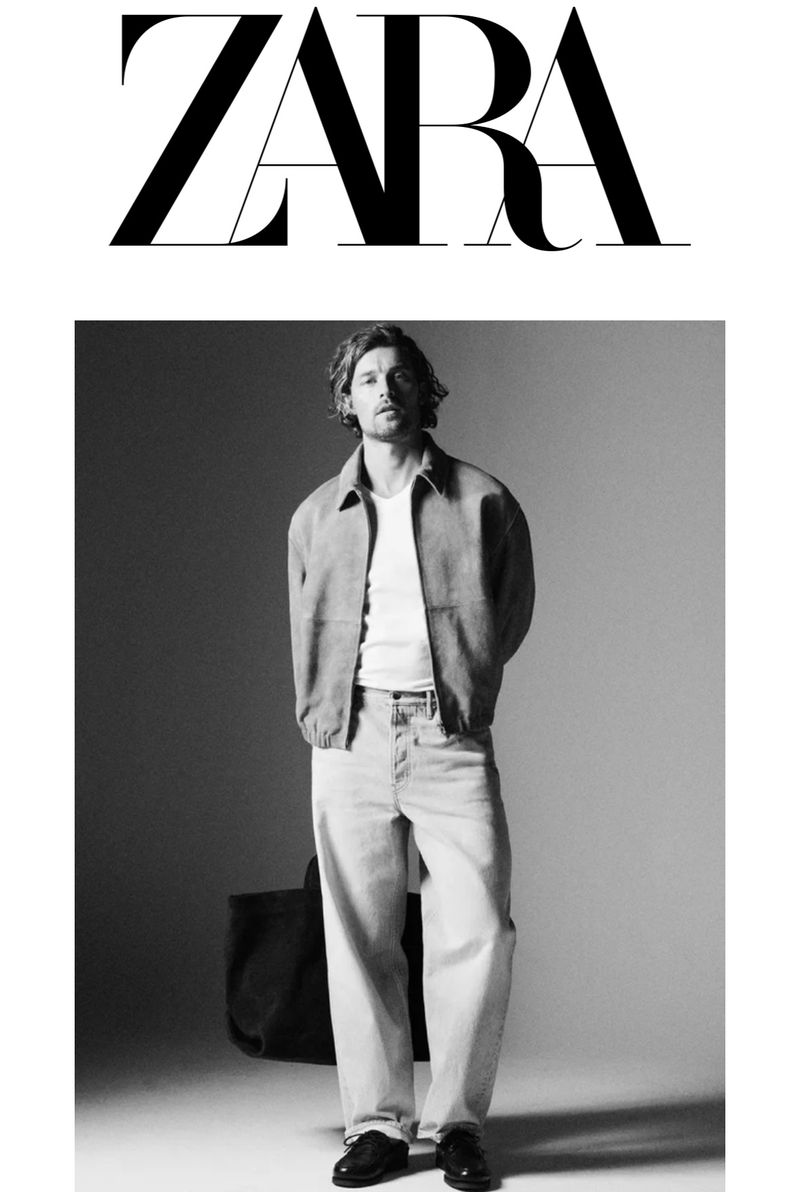 Zara fashion brand ad featuring a male model in a jacket, light-wash jeans, and dress shoes, posing with a tote bag against a gradient background.